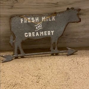 Hanging cow sign